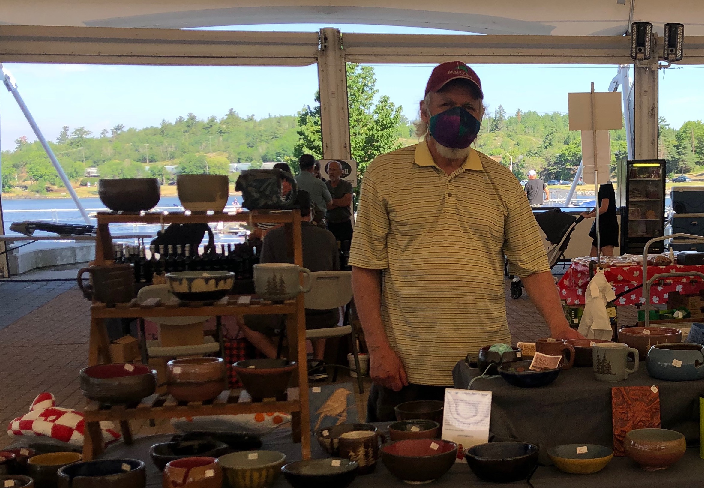 Man in mask with clay products