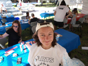 Everette Fournier looking at camera with kids arts and crafts in background.