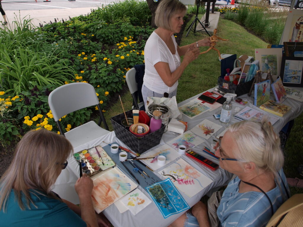 Susan Bulman demonstrating water colour painting