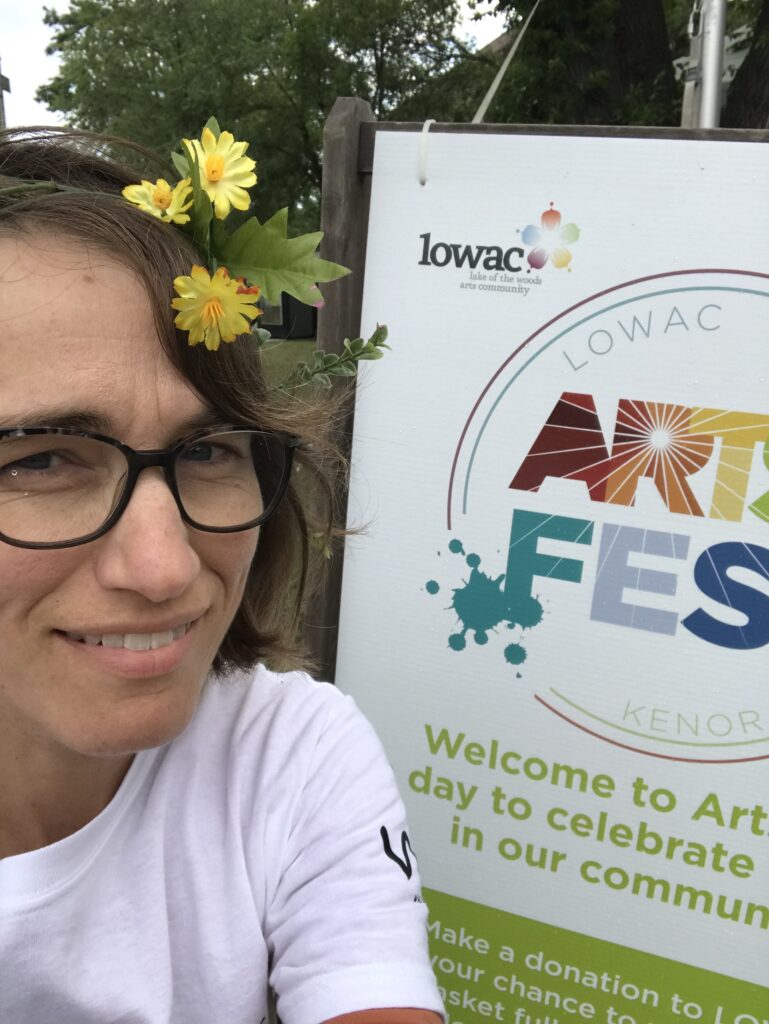 Shauna DeGagne with ArtsFest sign