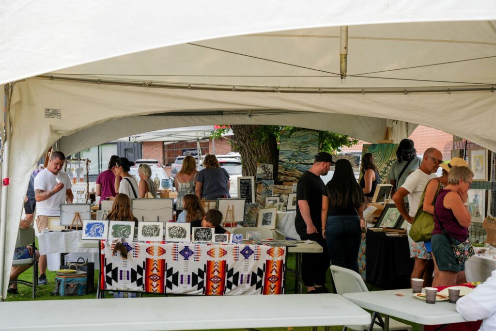 Crowd shot with a table with cards in forefront